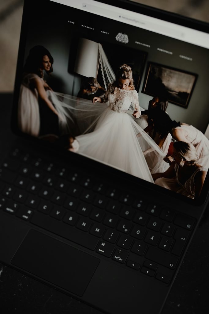 Bride and groom planning on laptop